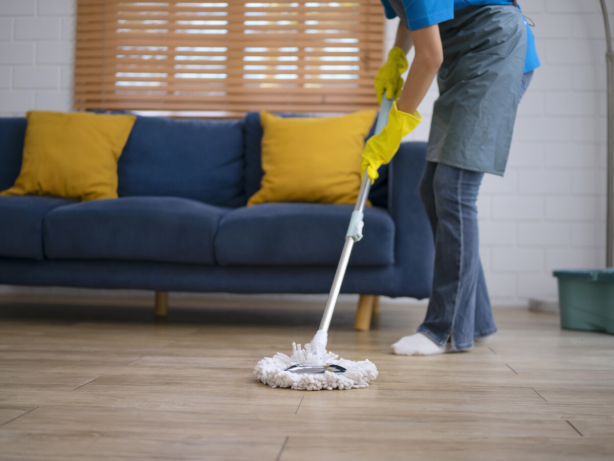 House keeper clean living room. Cleaning service and house keeping concept.